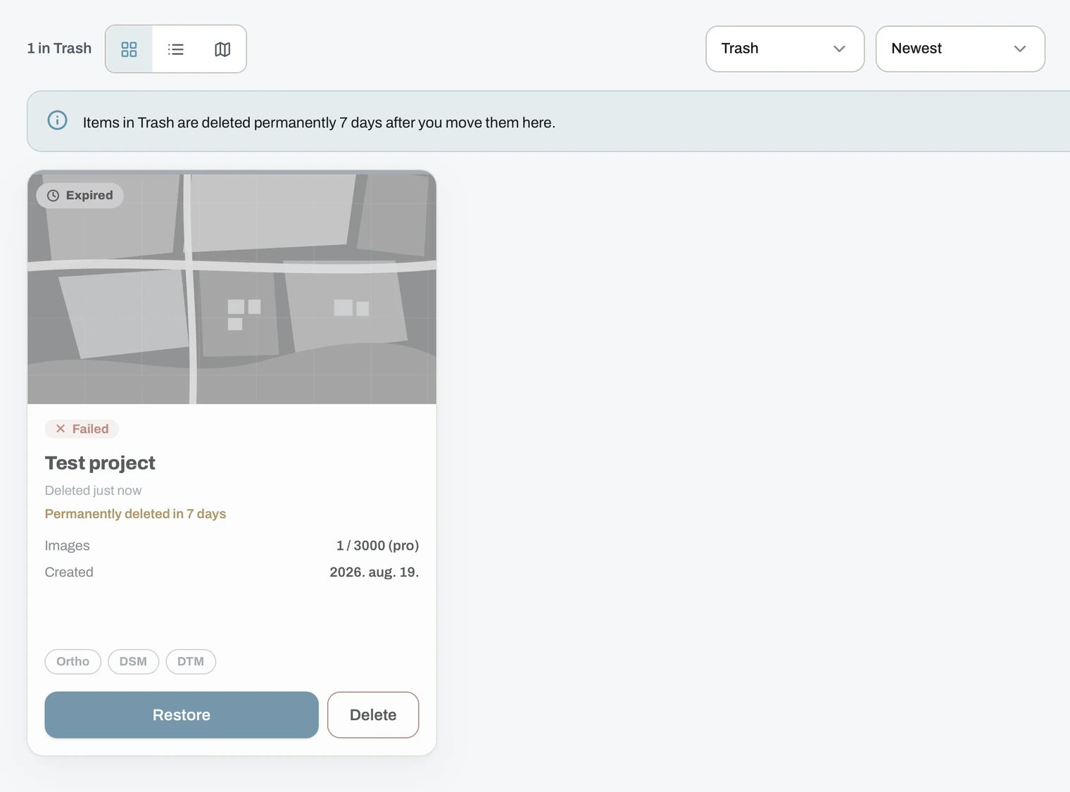 Trash view with a deleted project card showing Restore and Delete buttons